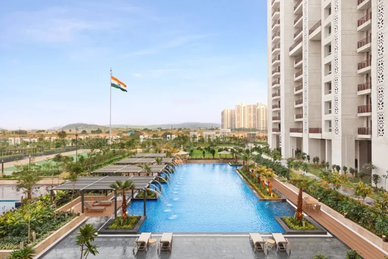 Residential towers with a swimming pool and landscaped gardens